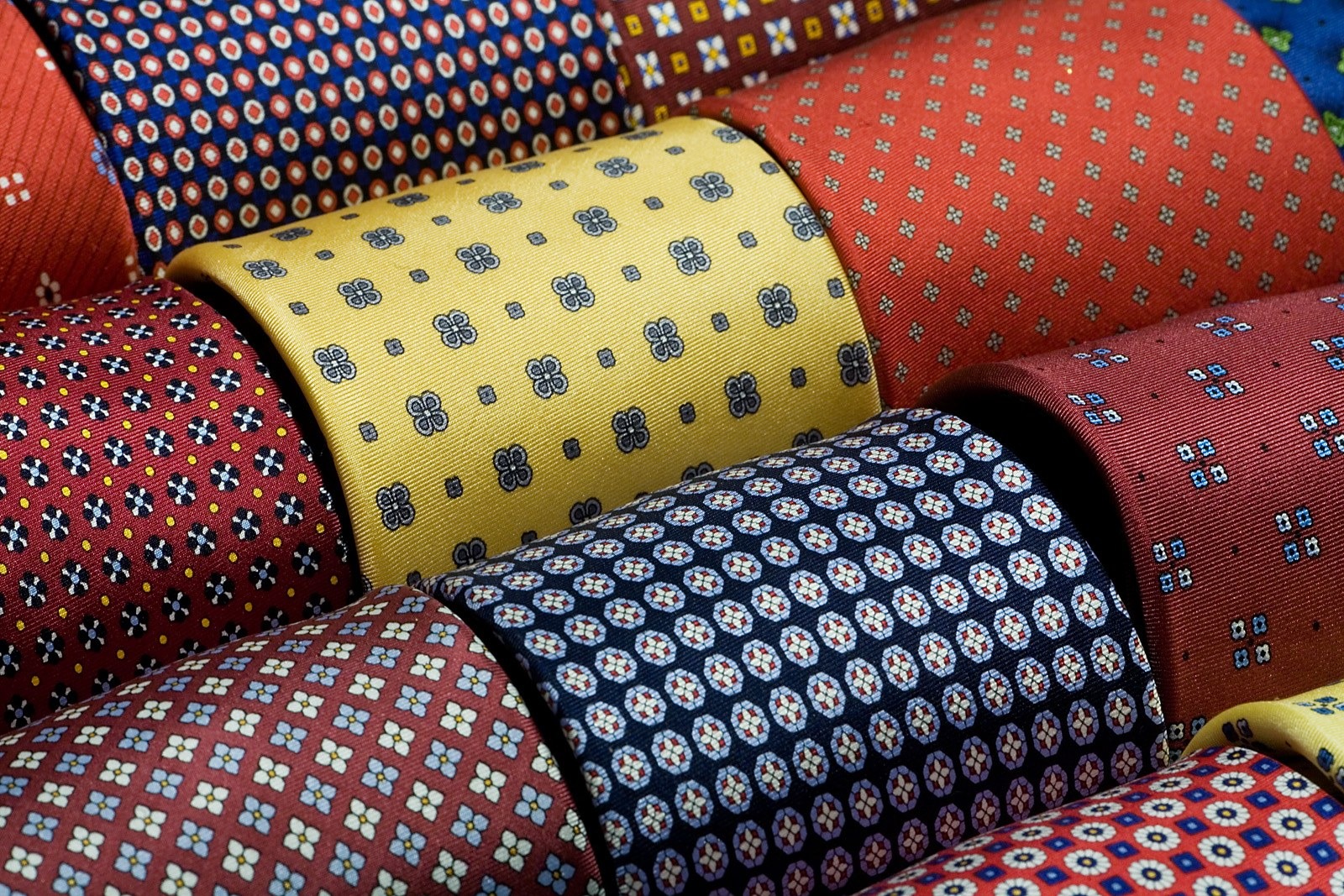 Printed and woven Italian silk ties rolled for display