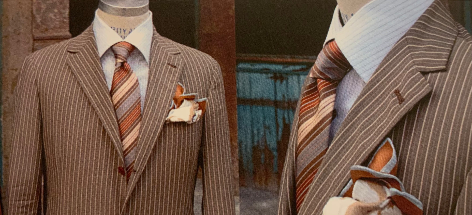 Two striped suits styled with rust and cream silk pocket squares