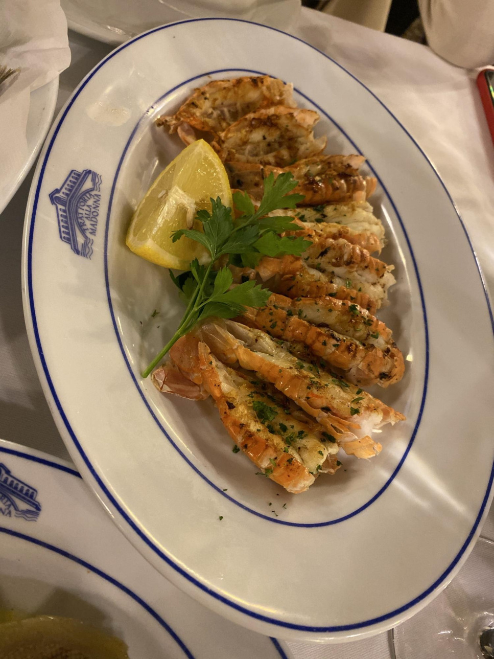 Grilled scampi on the house crested service