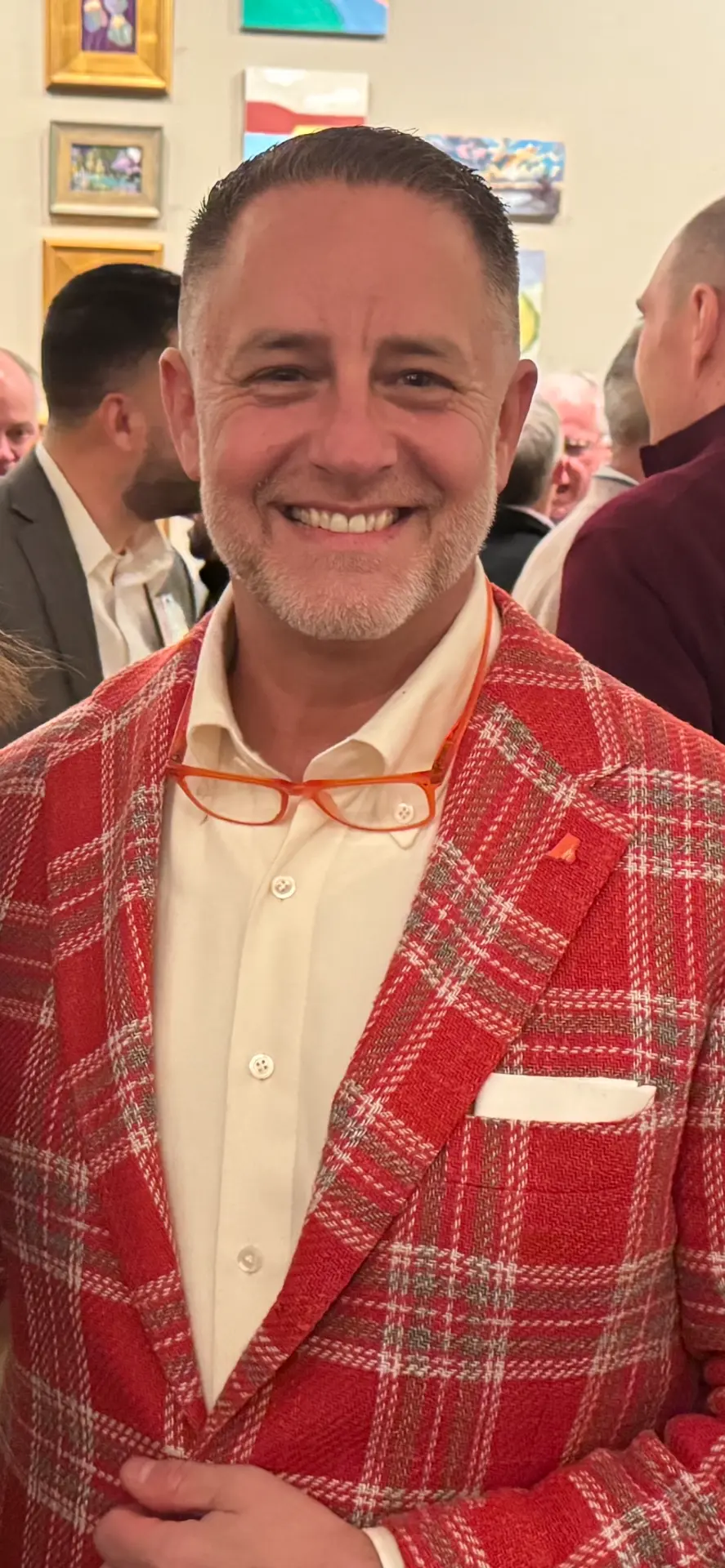 Marc Streisand wearing a red plaid jacket