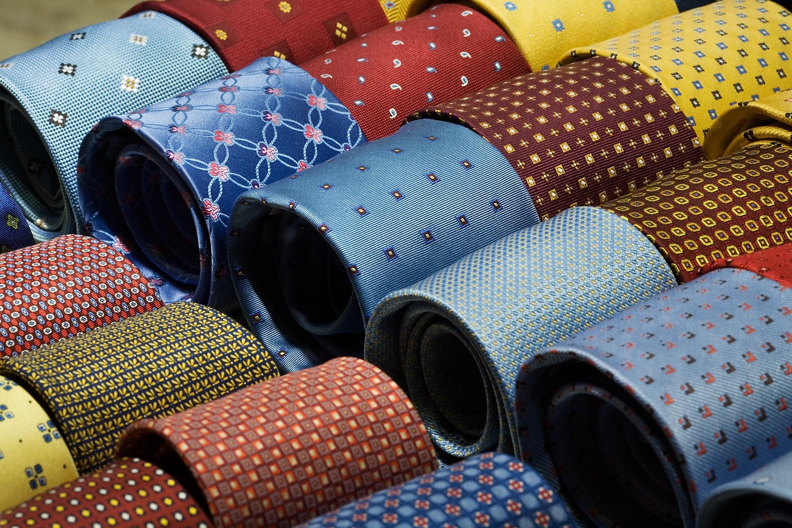 Rolled Italian silk ties in stripes, small repeats and printed foulards