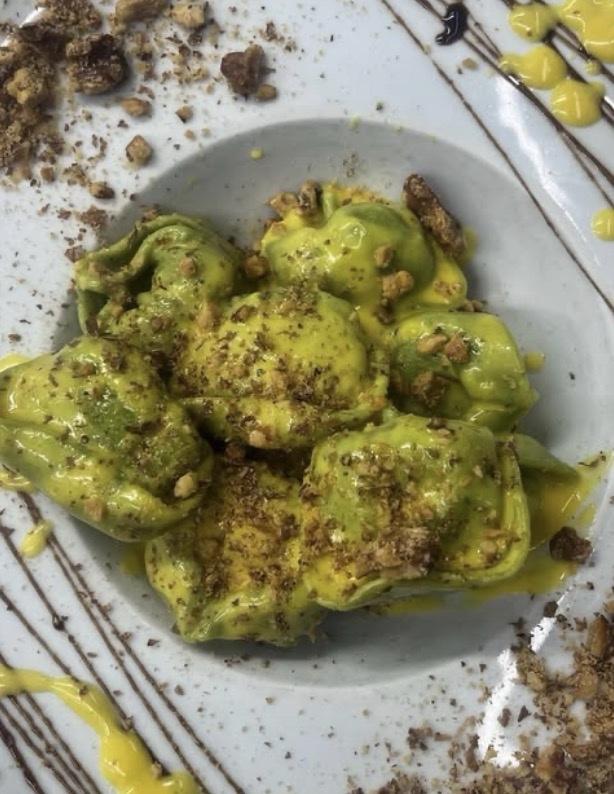 Spinach tortelli under a saffron cream