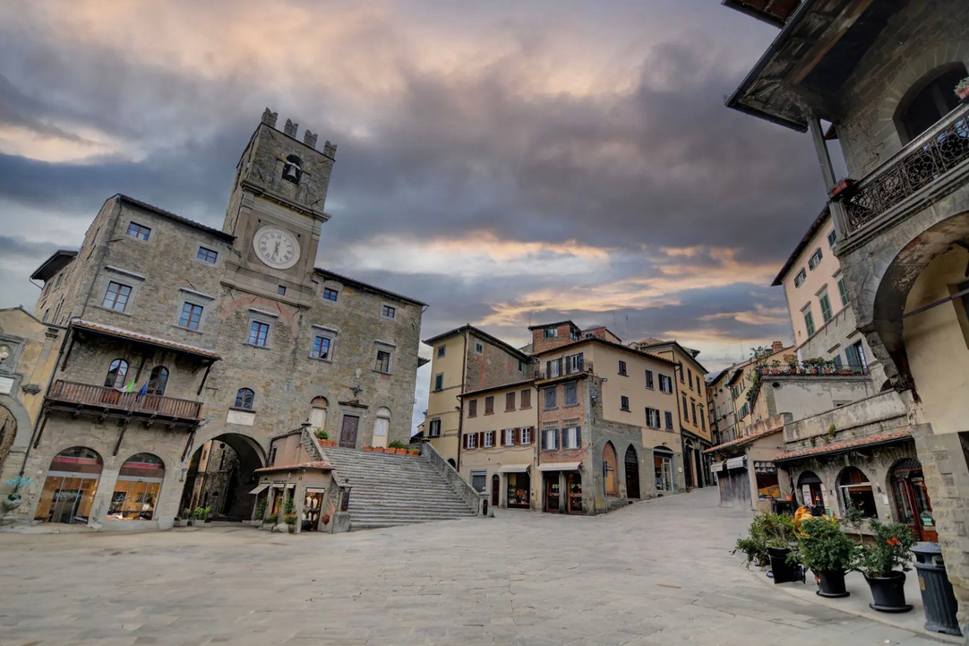 Cortona town square beneath an autumn sky