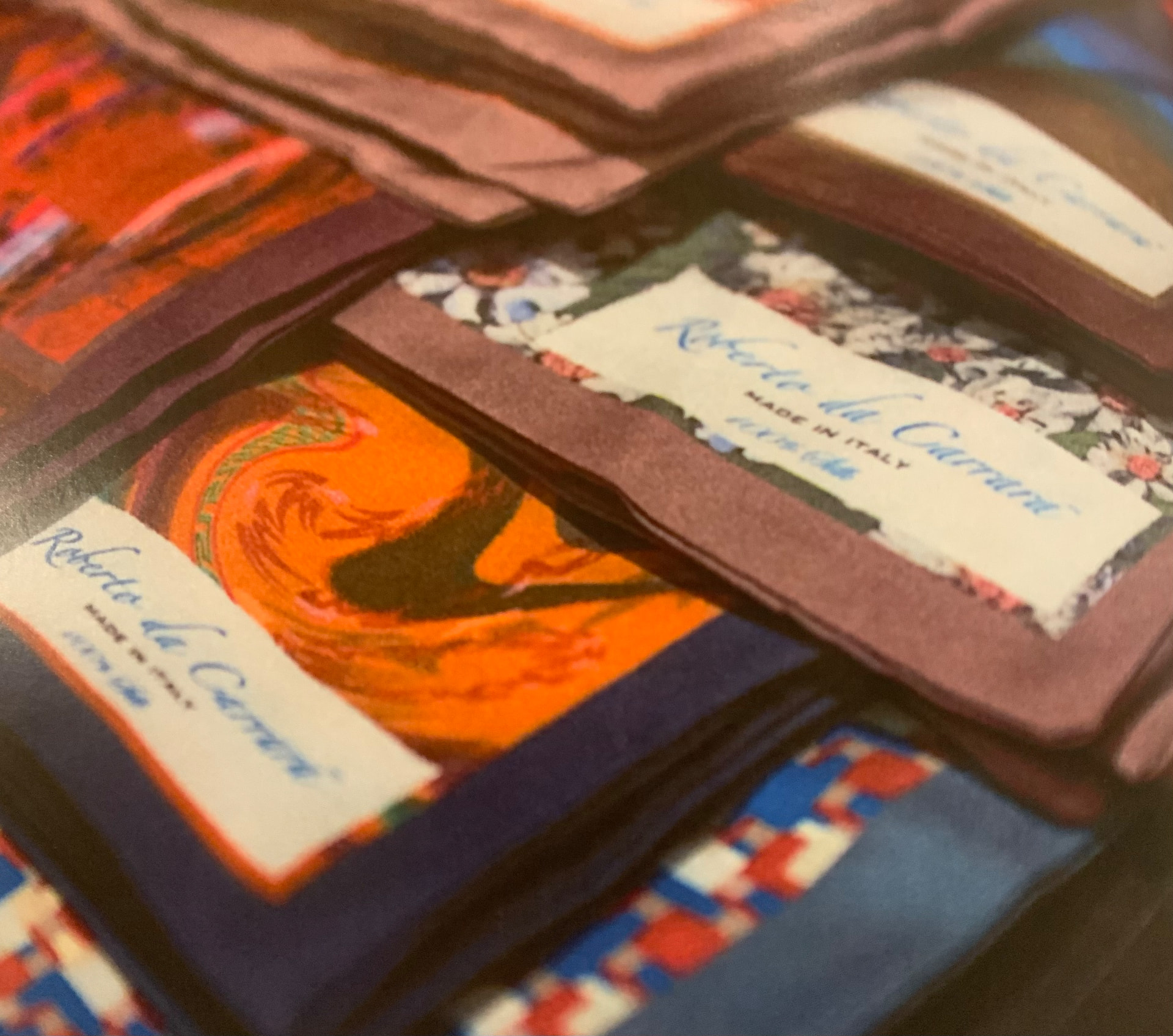 A collection of Roberto da Carrara printed silk pocket squares