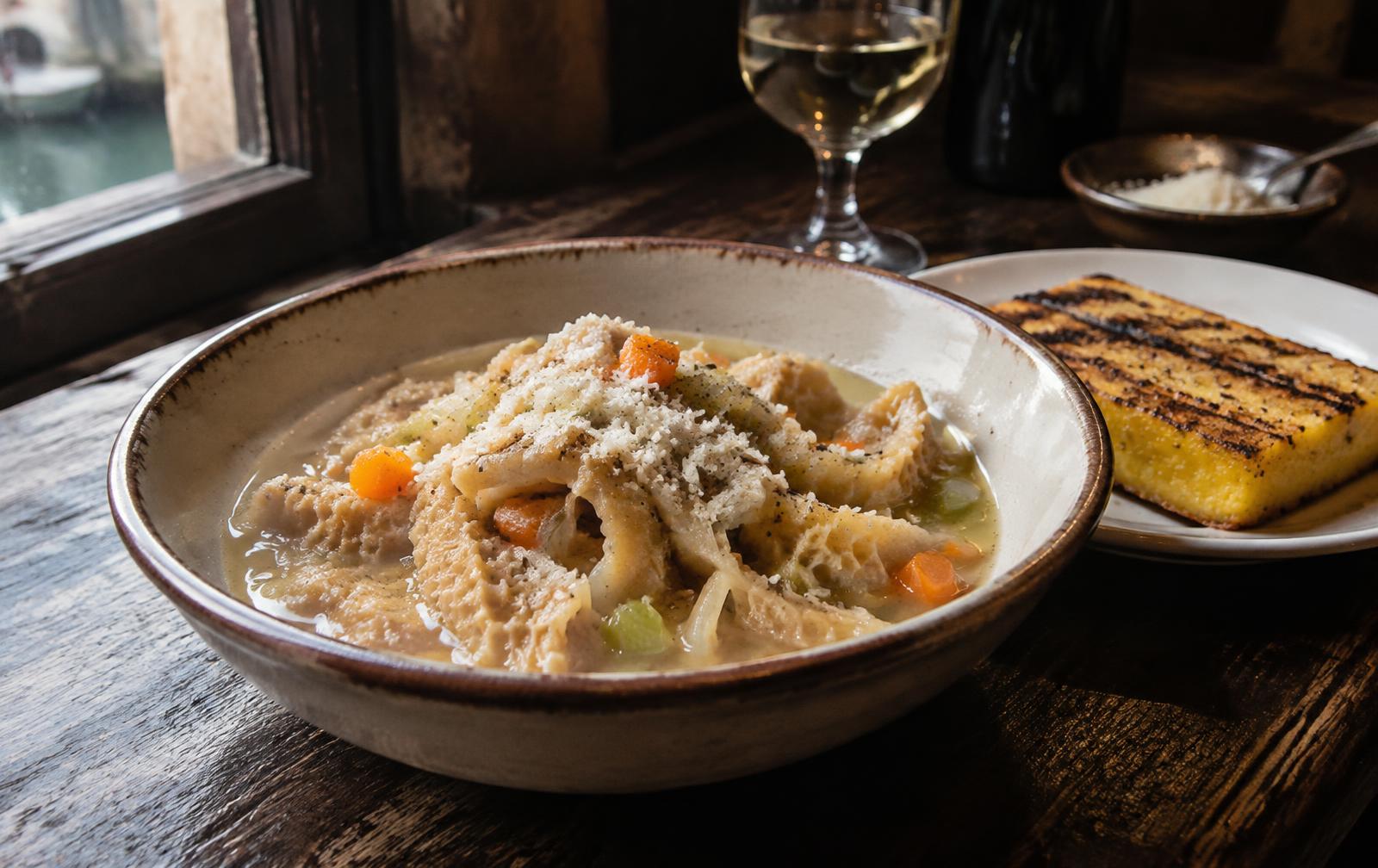 Trippa alla Veneziana in broth with grilled polenta