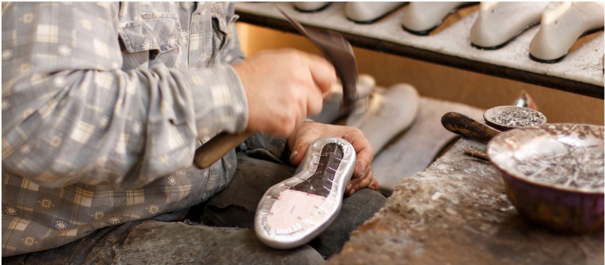 A craftsman at work on a leather sole