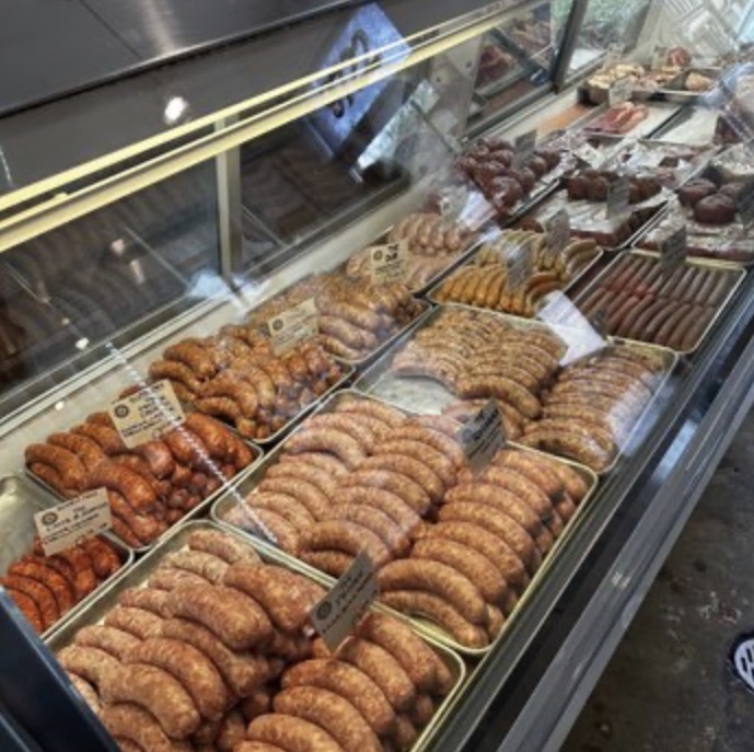 The Proper Sausage butcher case with small-batch sausages